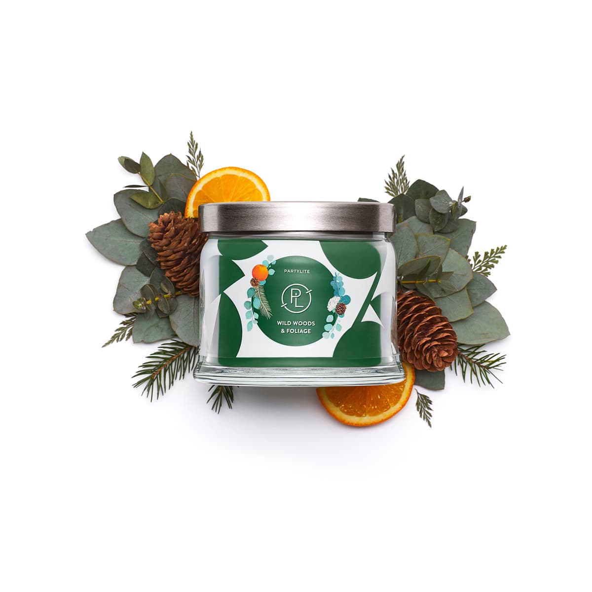 Wild Woods & Foliage 3-Wick Jar Candle surrounded by orange slices and pine cones with leaves against a white background.