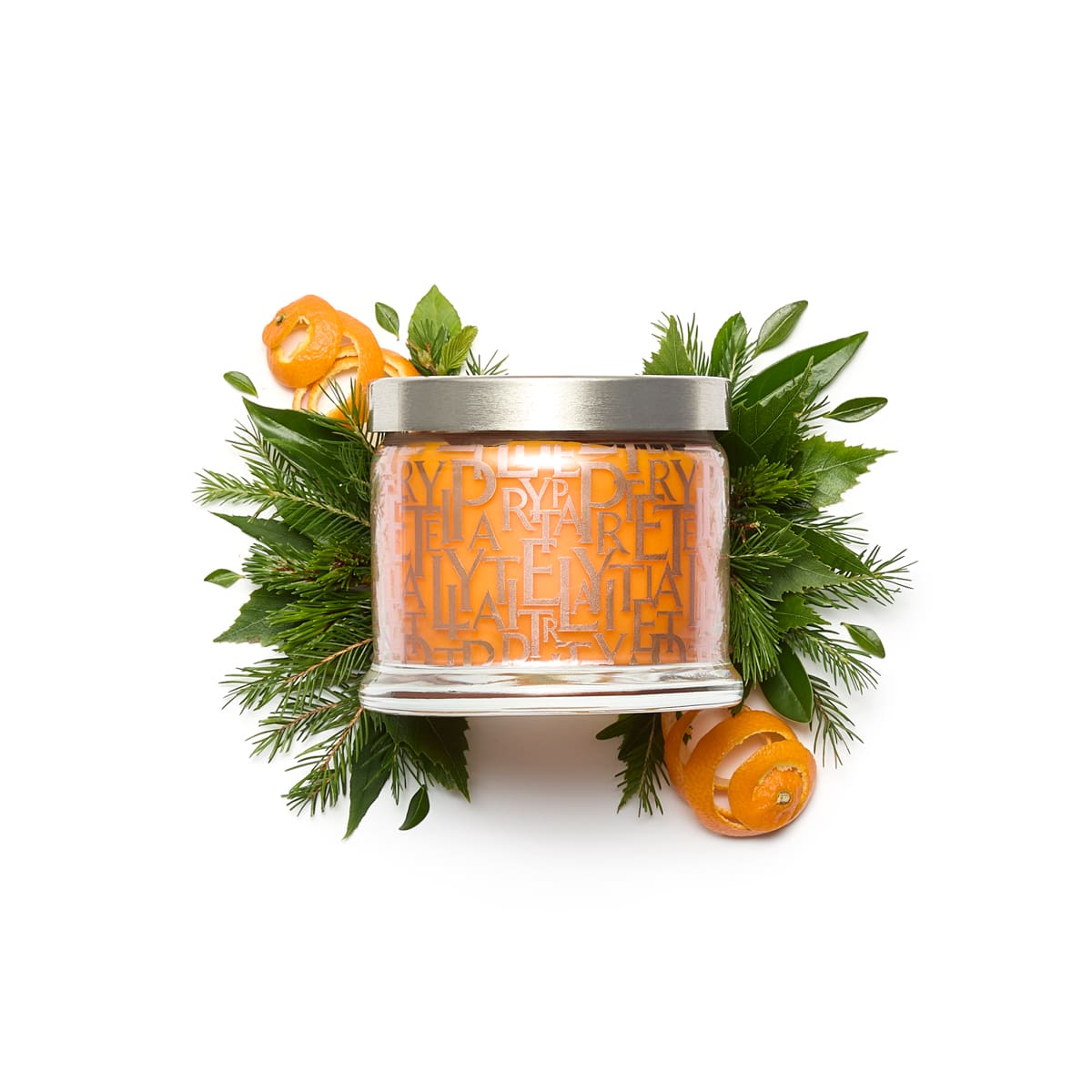 Leaves of Fun 3-Wick Jar Candle, surrounded by fir leaves and orange peels against a white background.