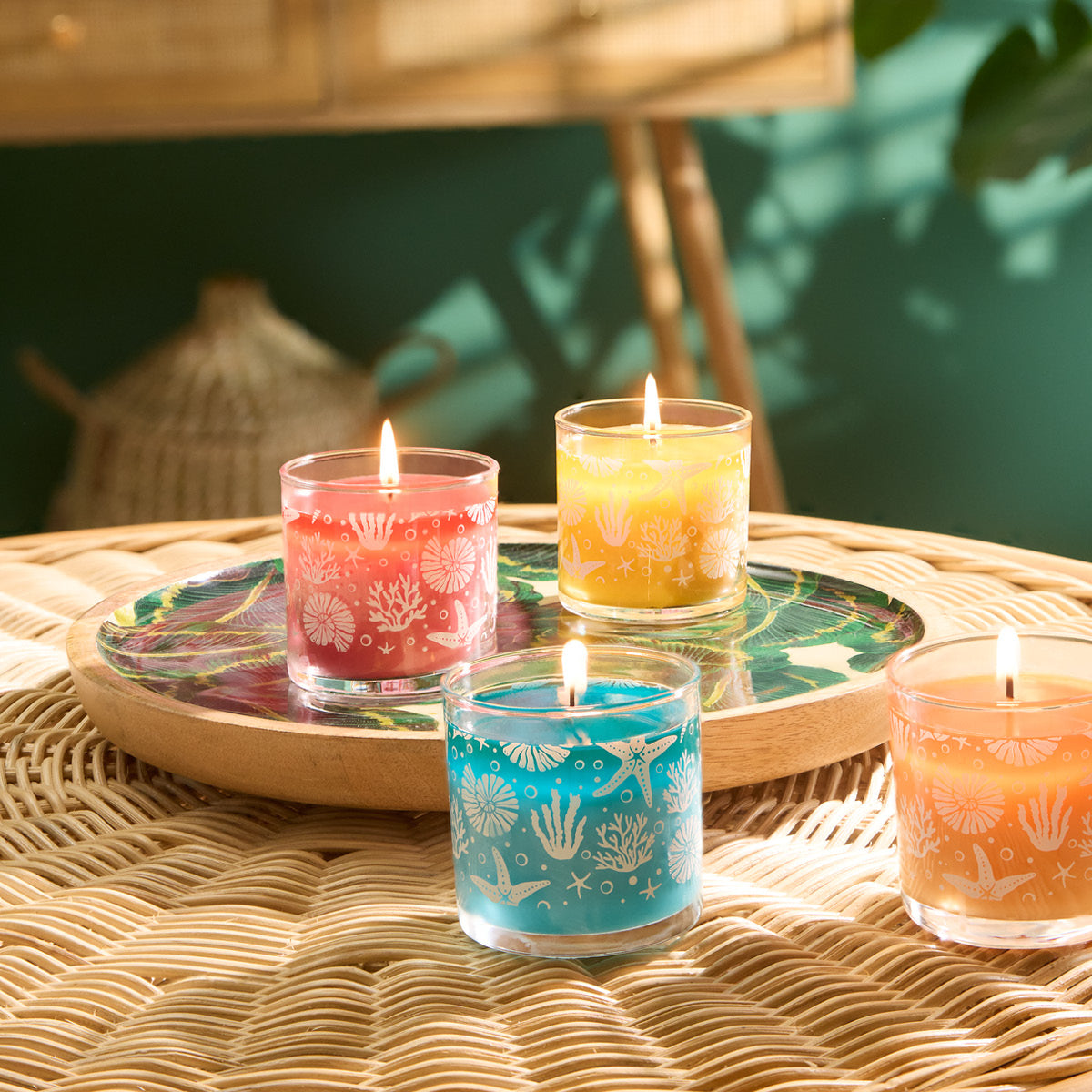 Colorful assorted Mini Jars on a decorative wood plate on a woven surface